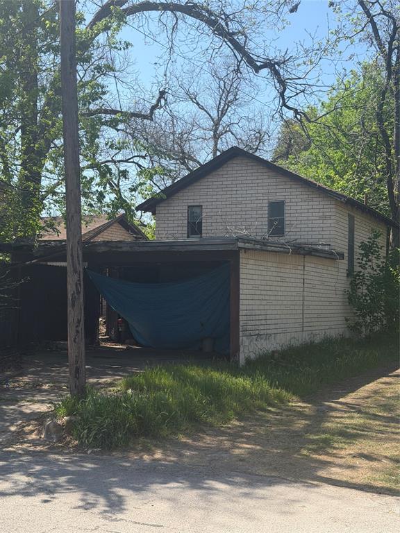 514 Tyler Street Waco, TX 76704 - Photo 8 of 11 a house view with a backyard