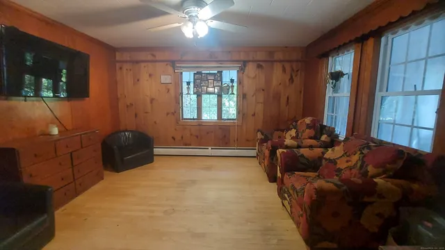 a living room with furniture and a window