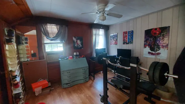 a view of a livingroom with furniture and a window