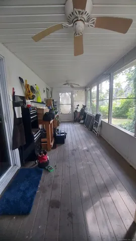 a living room with lots of furniture and a chandelier