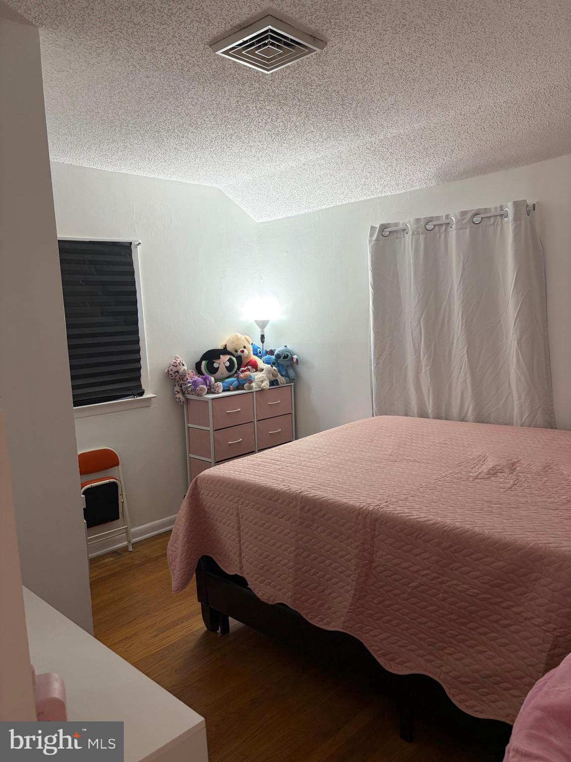 7404 Wyndam Road Pennsauken, NJ 08110 - Photo 31 of 50 a bedroom with a bed and a table in it