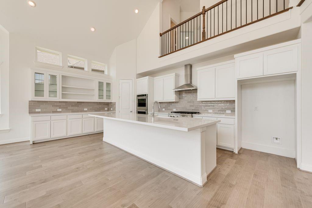 2807 Augustus Way Mansfield, TX 76063 - Photo 11 of 40 a kitchen with stainless steel appliances granite countertop a sink and cabinets