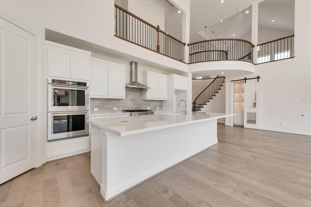 2807 Augustus Way Mansfield, TX 76063 - Photo 14 of 40 a view of kitchen with stainless steel appliances kitchen island with wooden floor