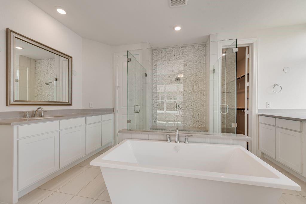 2807 Augustus Way Mansfield, TX 76063 - Photo 19 of 40 a spacious bathroom with a tub sink and mirror