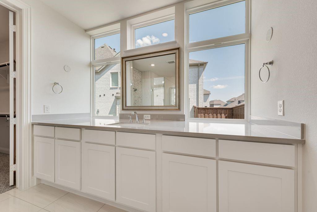 2807 Augustus Way Mansfield, TX 76063 - Photo 21 of 40 a bathroom with a sink and a mirror
