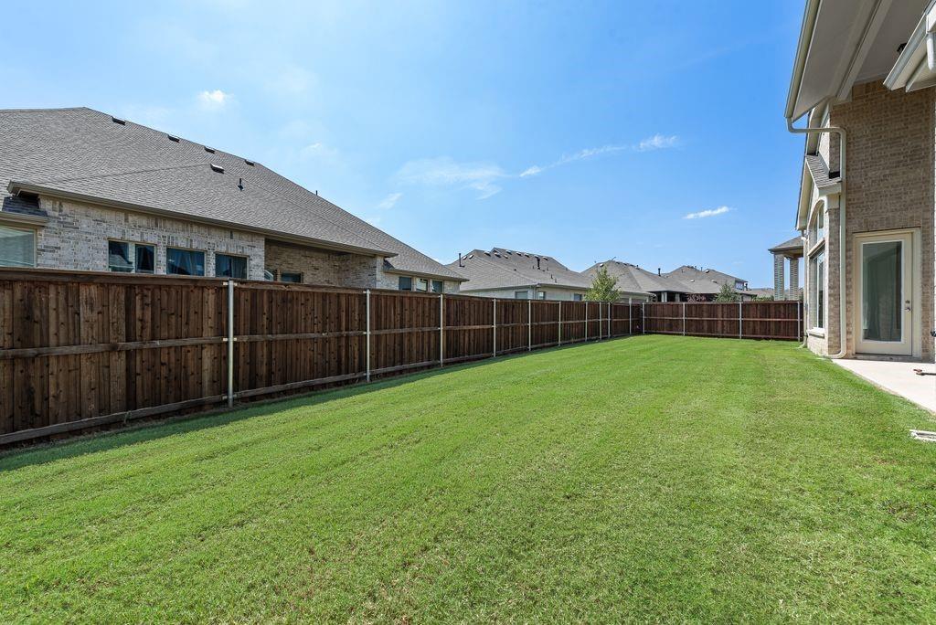 2807 Augustus Way Mansfield, TX 76063 - Photo 36 of 40 a view of a backyard with a garden