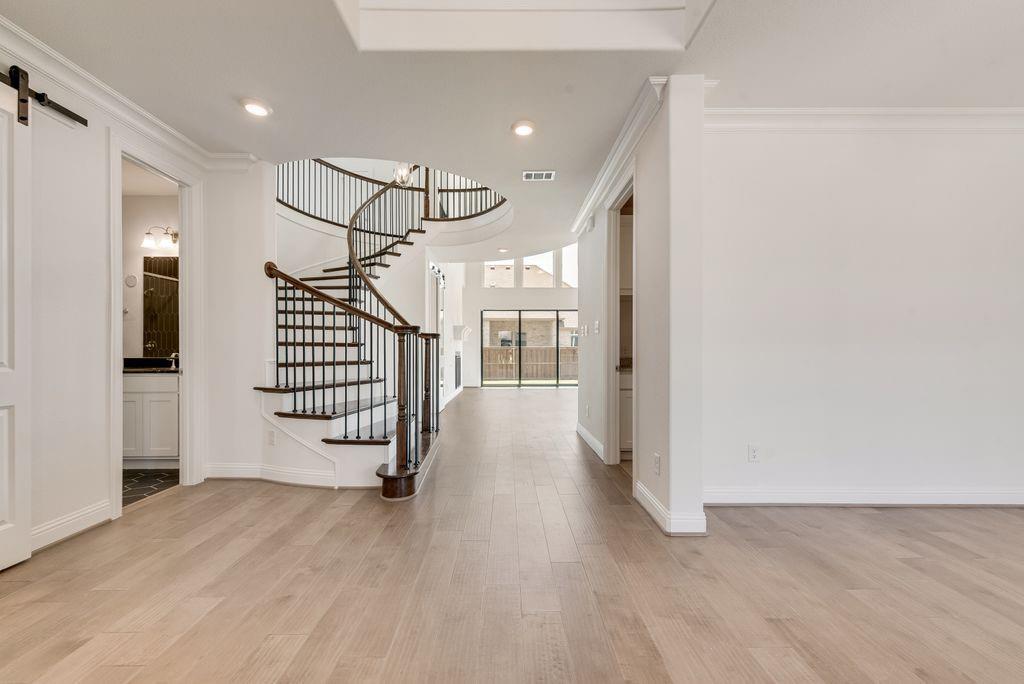 2807 Augustus Way Mansfield, TX 76063 - Photo 4 of 40 a view of entryway with stairs and wooden floor