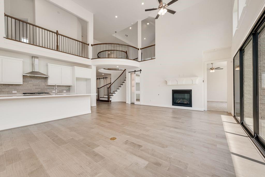2807 Augustus Way Mansfield, TX 76063 - Photo 10 of 40 an empty room with fireplace and windows