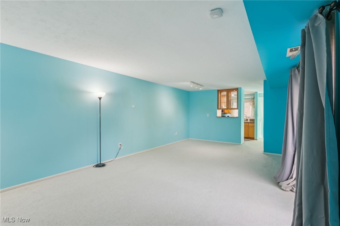 3484 Mayfield Road, Unit 3426 Cleveland Heights, OH 44118 - Photo 28 of 33 Spare room with light colored carpet, visible vents, and baseboards