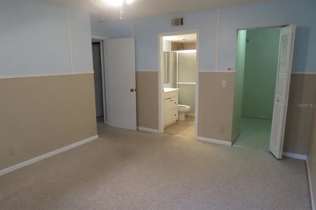 wooden floor and closet in a room