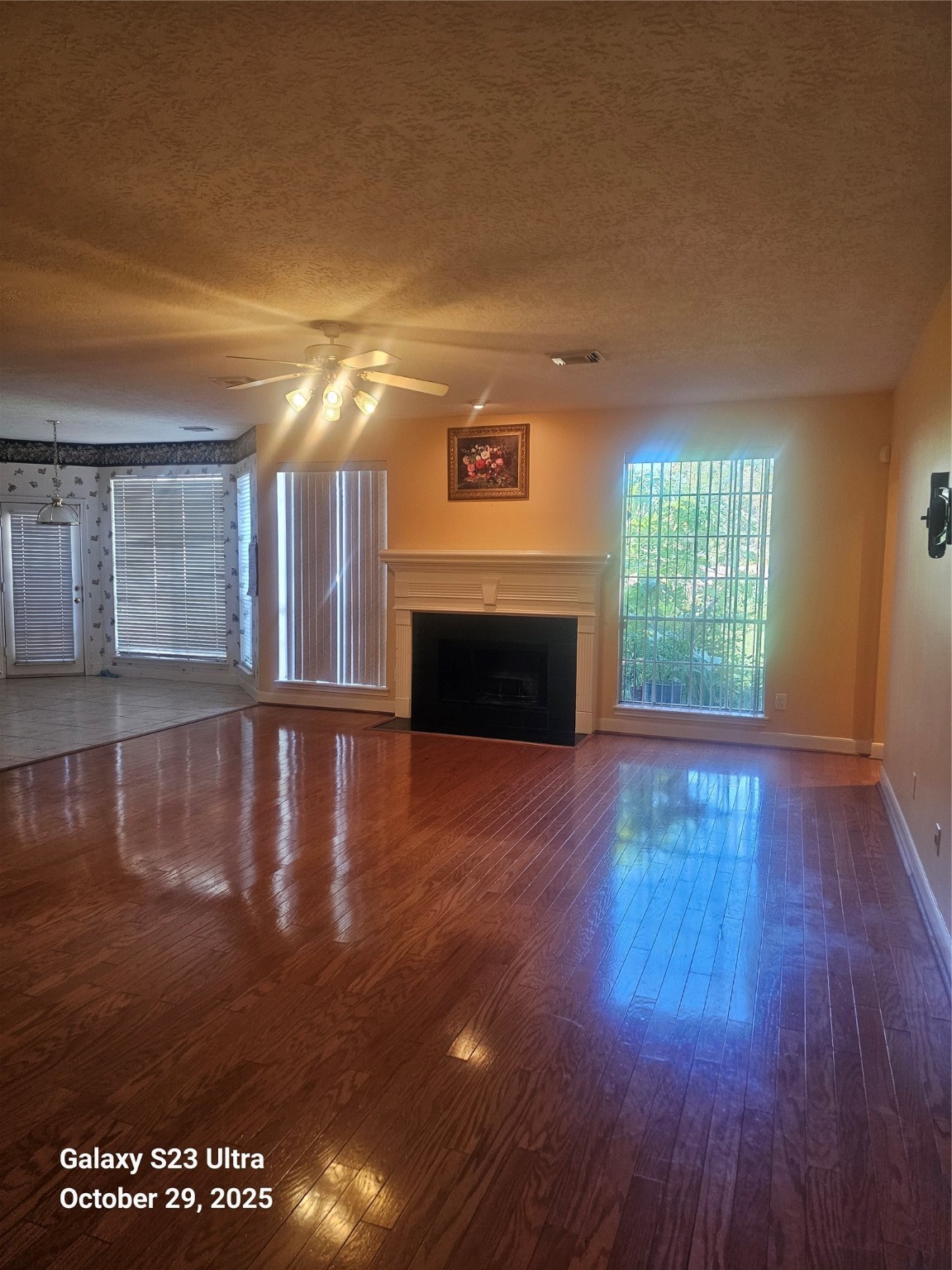 4914 Plantation Colony Drive Sugar Land, TX 77478 - Photo 14 of 16 a view of empty room with wooden floor and fireplace