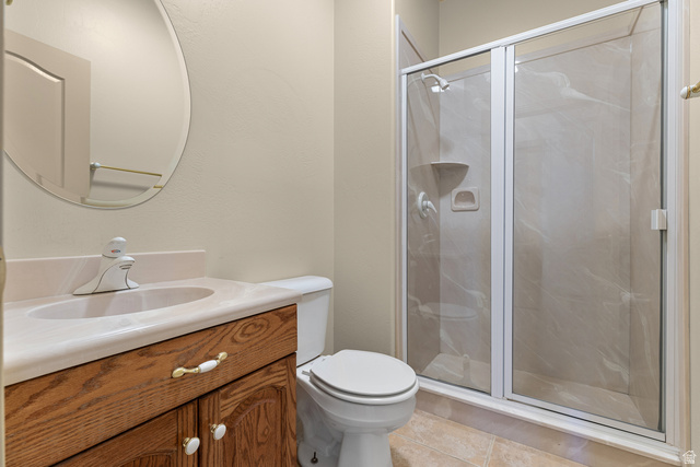 389 North Main Street St. George, UT 84770 - Photo 14 of 44 Bathroom with vanity, a shower stall, and light tile patterned floors