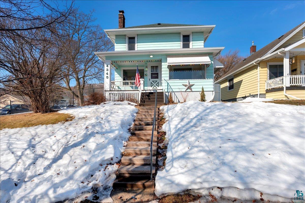4345 West 8th Street Duluth, MN 55807 - Photo 1 of 31 American foursquare style home with a chimney and a porch