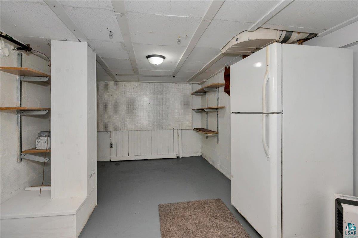 4345 West 8th Street Duluth, MN 55807 - Photo 28 of 31 Finished below grade area with freestanding refrigerator