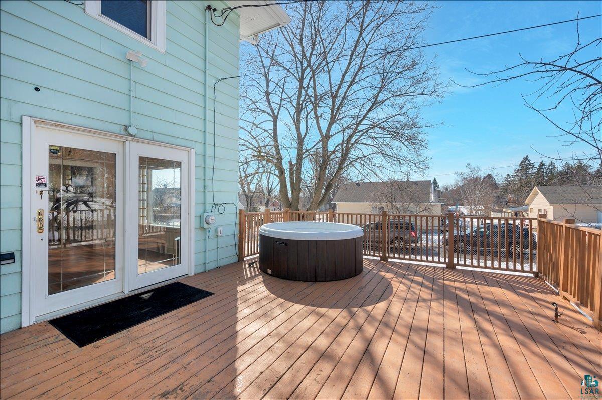 4345 West 8th Street Duluth, MN 55807 - Photo 3 of 31 Wooden terrace featuring a hot tub, a residential view, and french doors