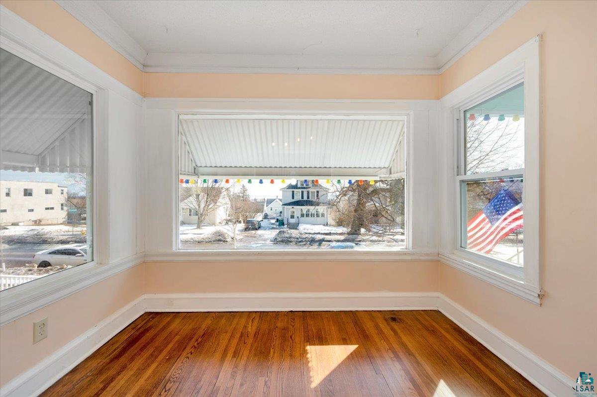 4345 West 8th Street Duluth, MN 55807 - Photo 5 of 31 Unfurnished room with light wood-style floors and crown molding