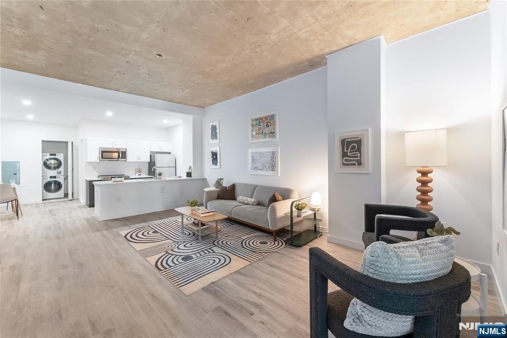 10 Commerce Court, Unit 2E Newark, NJ 07102 - Photo 6 of 17 a living room with furniture and a wooden floor