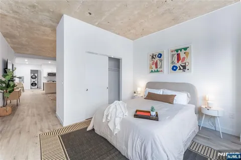 a living room with furniture and wall painting