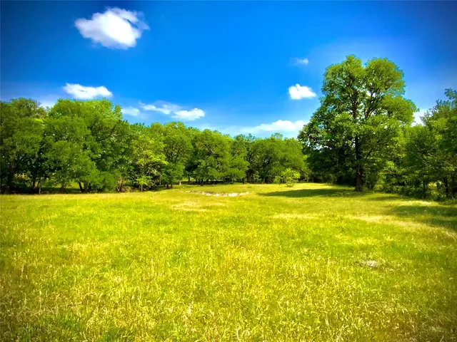 a view of yard with swimming pool and outdoor seating