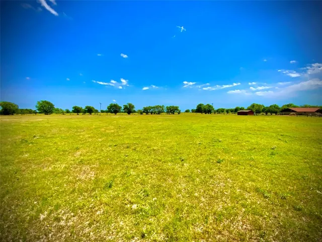 a view of a golf course with a lake