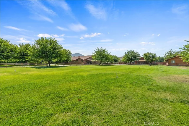 a view of a green field with clear sky