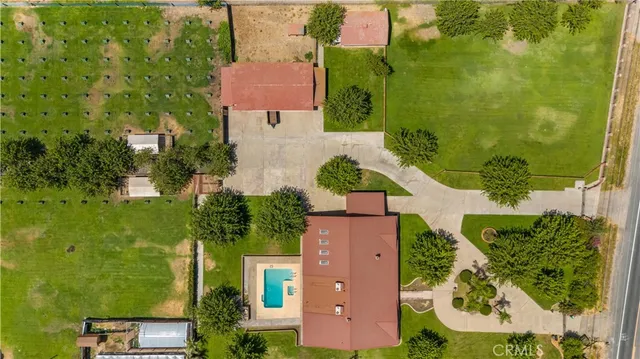 an aerial view of a house with a yard