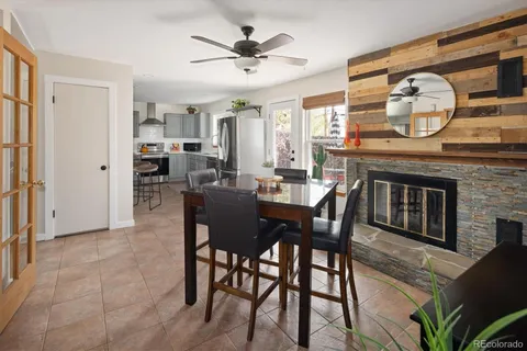 a view of a dining room with furniture and a large window