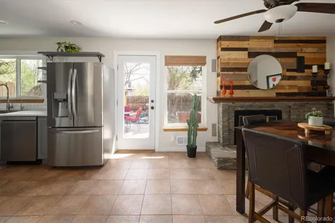 a kitchen with refrigerator and cabinets