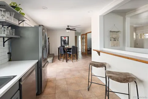 a view of kitchen with furniture and large window