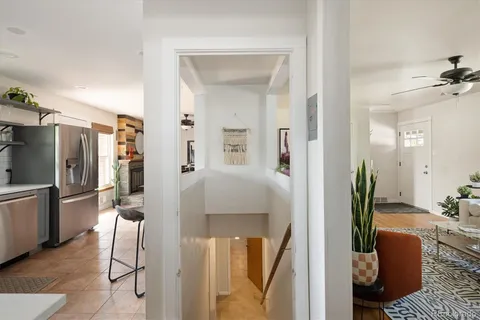 a en suite bathroom with a granite countertop sink and a mirror