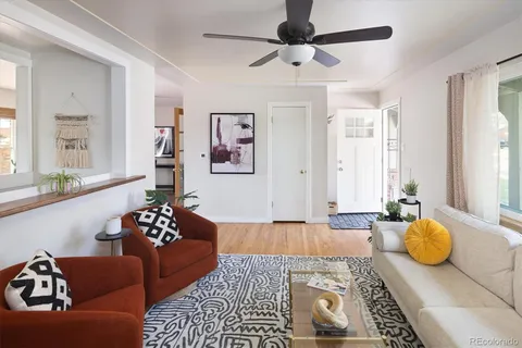 a bedroom with furniture and a rug