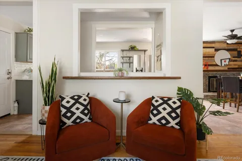 a living room with furniture and flat screen tv