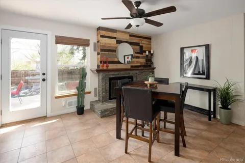 a dining room with furniture and window