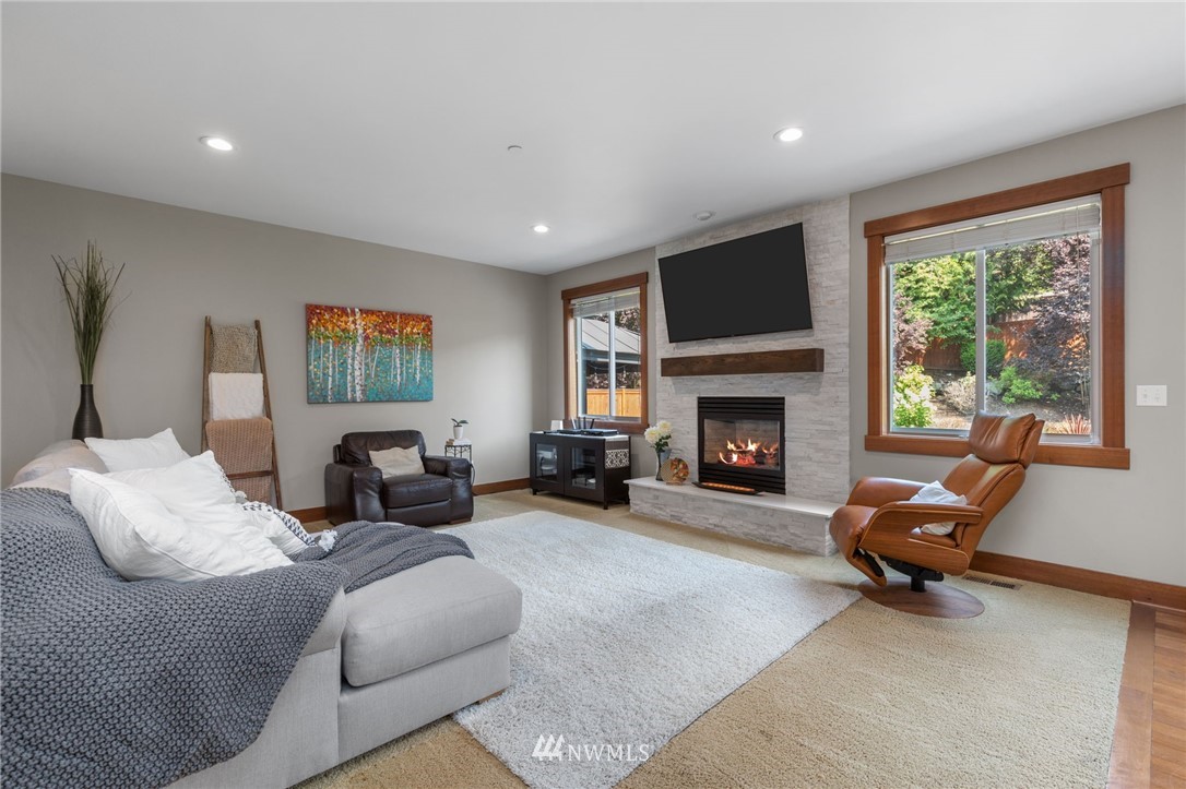 3113 223rd Street Southeast Bothell, WA 98021 - Photo 2 of 40 a living room with furniture window and a fireplace
