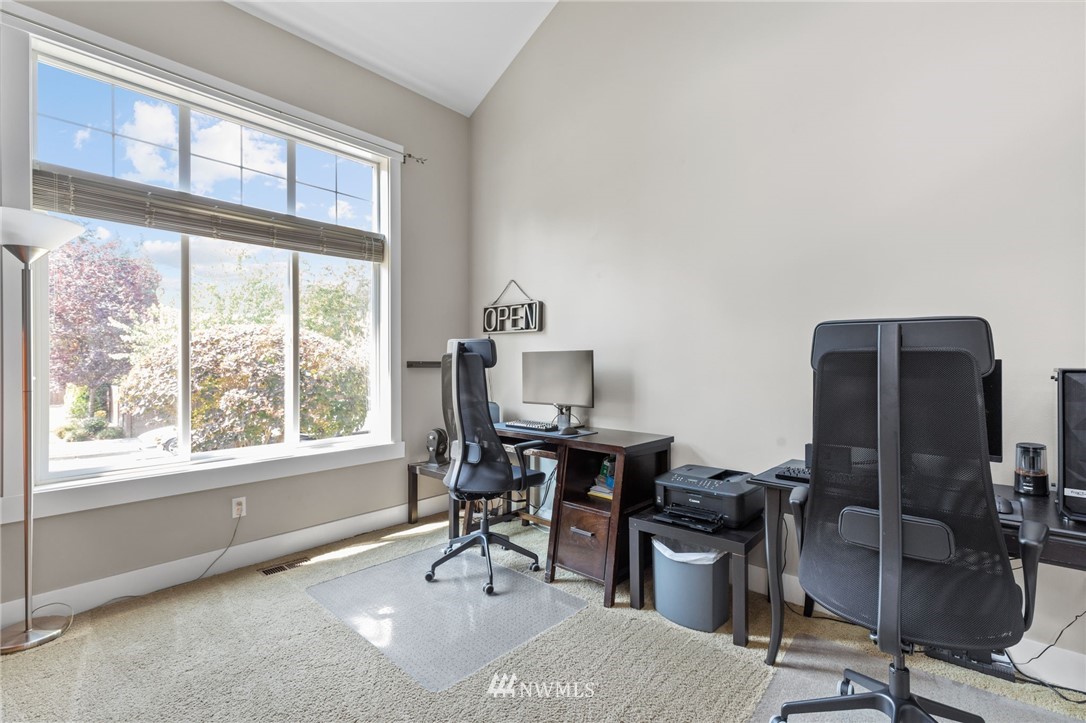 3113 223rd Street Southeast Bothell, WA 98021 - Photo 20 of 40 a view of a workspace with furniture and a window