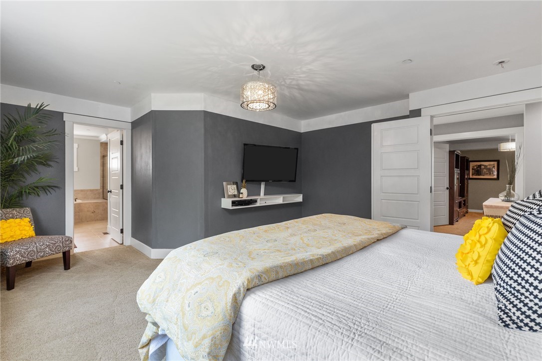 3113 223rd Street Southeast Bothell, WA 98021 - Photo 25 of 40 a bedroom with a bed and a television