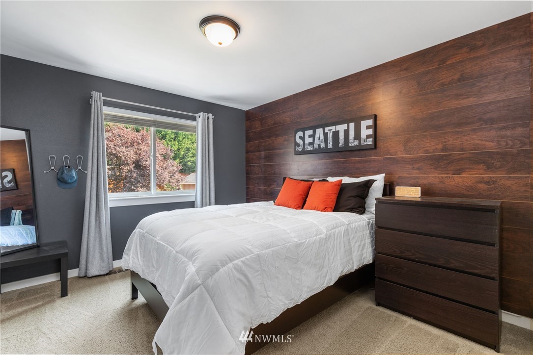 3113 223rd Street Southeast Bothell, WA 98021 - Photo 27 of 40 a bedroom with a bed and window