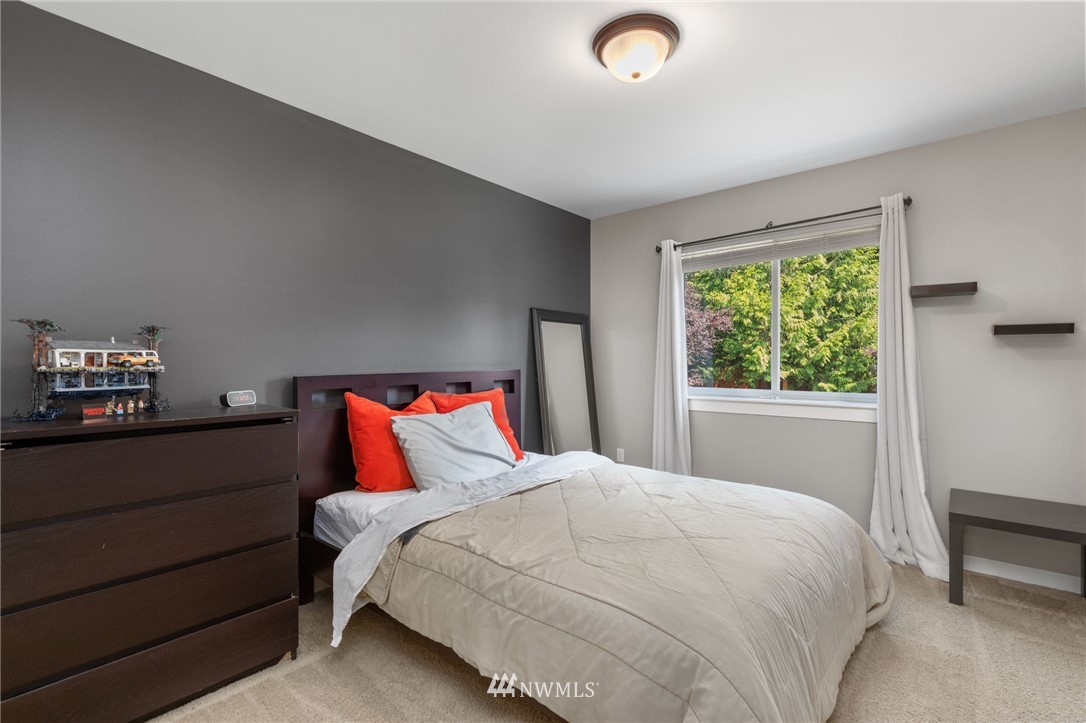 3113 223rd Street Southeast Bothell, WA 98021 - Photo 29 of 40 a bedroom with a bed and a window