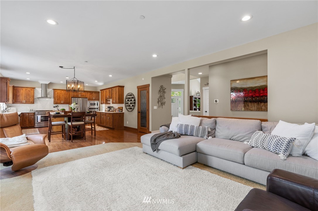 3113 223rd Street Southeast Bothell, WA 98021 - Photo 4 of 40 a living room with furniture and kitchen view