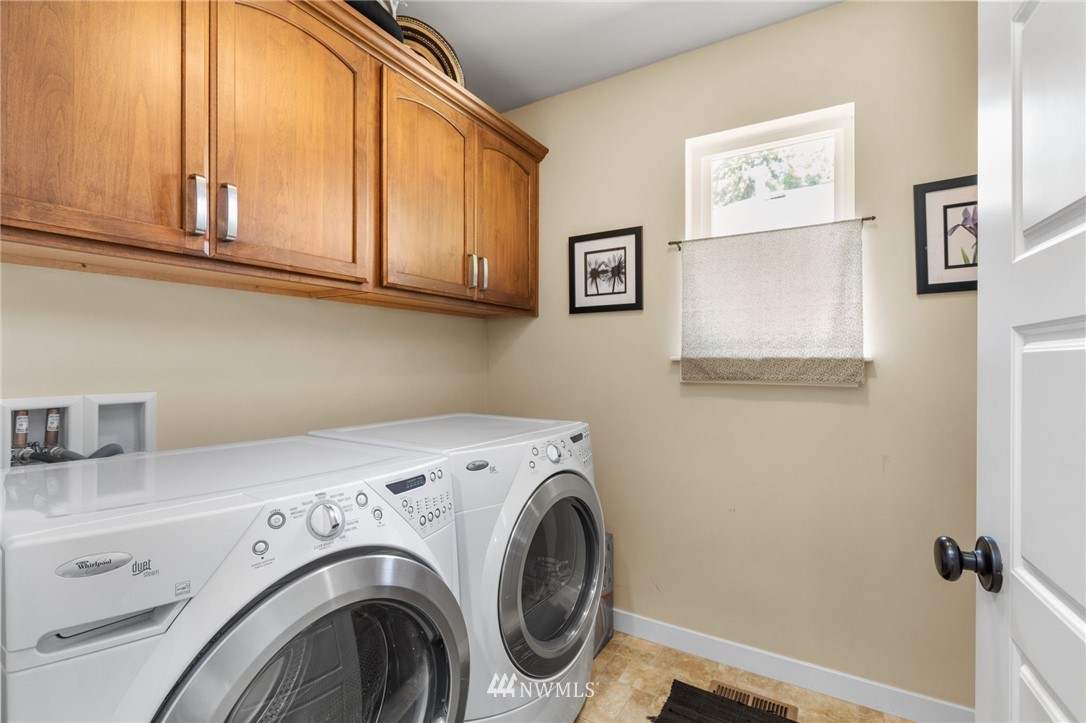 3113 223rd Street Southeast Bothell, WA 98021 - Photo 37 of 40 a utility room with dryer and washer