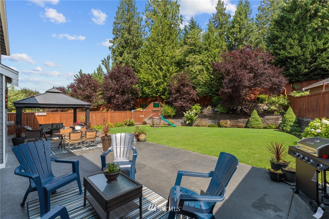 3113 223rd Street Southeast Bothell, WA 98021 - Photo 38 of 40 a view of a patio with furniture