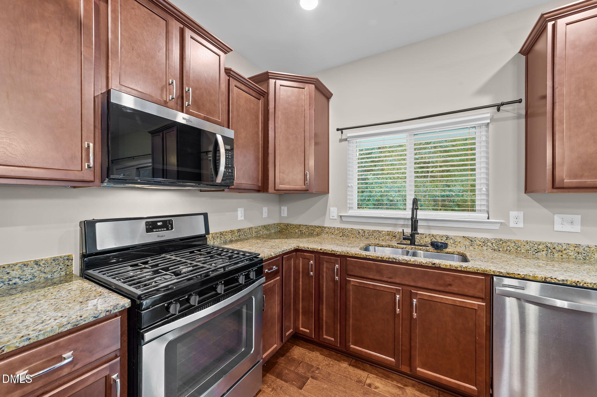 26 Mint Julip Circle Clayton, NC 27527 - Photo 17 of 46 a kitchen with granite countertop cabinets sink stainless steel appliances and a counter space