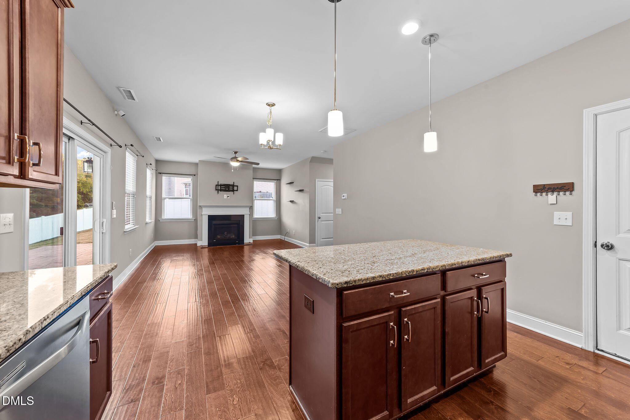 26 Mint Julip Circle Clayton, NC 27527 - Photo 18 of 46 a kitchen with a wooden floor and a refrigerator