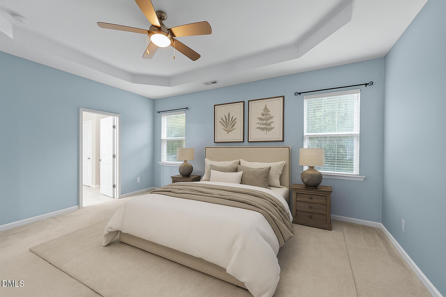 26 Mint Julip Circle Clayton, NC 27527 - Photo 21 of 46 a bedroom with a large bed and two window