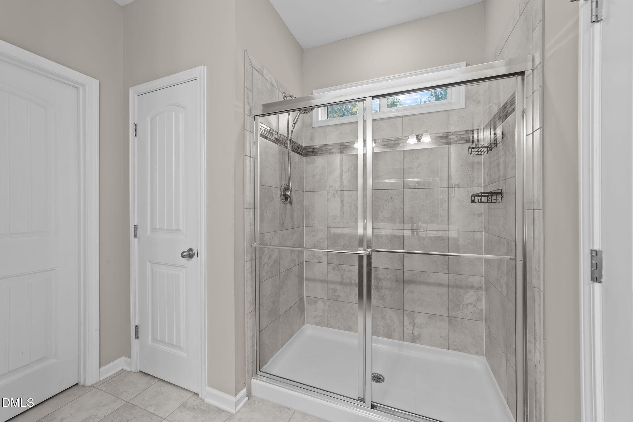 26 Mint Julip Circle Clayton, NC 27527 - Photo 25 of 46 a bathroom with a glass shower door