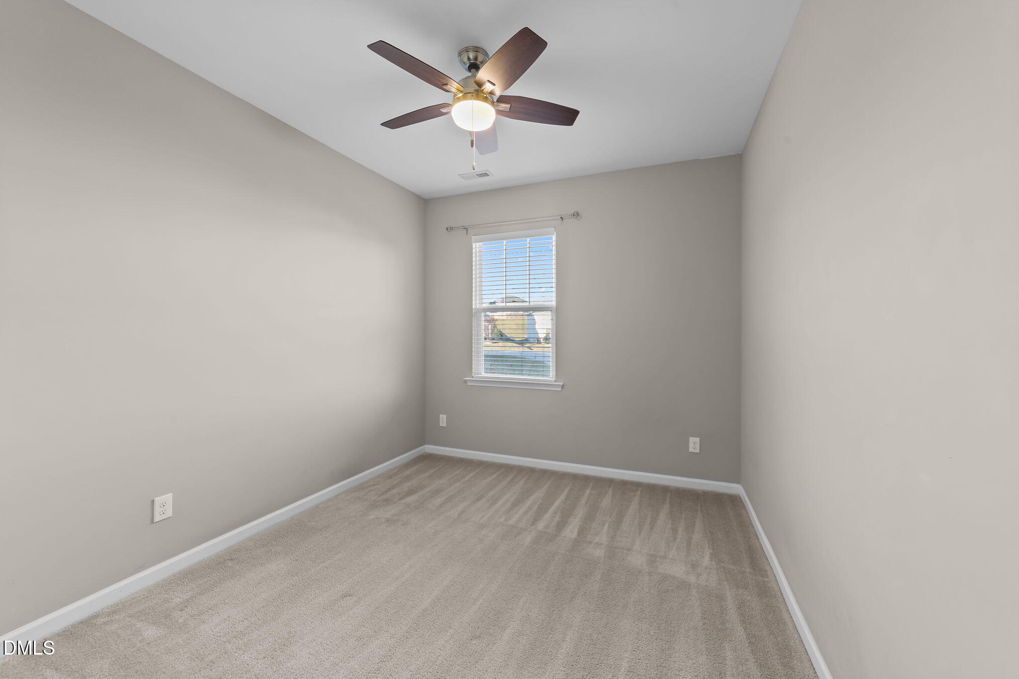 26 Mint Julip Circle Clayton, NC 27527 - Photo 35 of 46 an empty room with a window and a fan