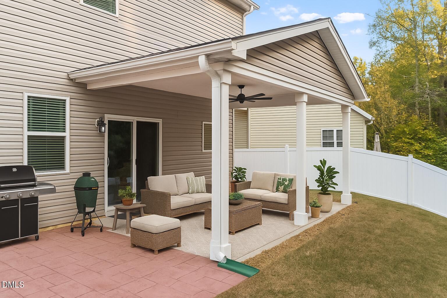 26 Mint Julip Circle Clayton, NC 27527 - Photo 40 of 46 a view of a patio with couches and table and chairs and potted plants