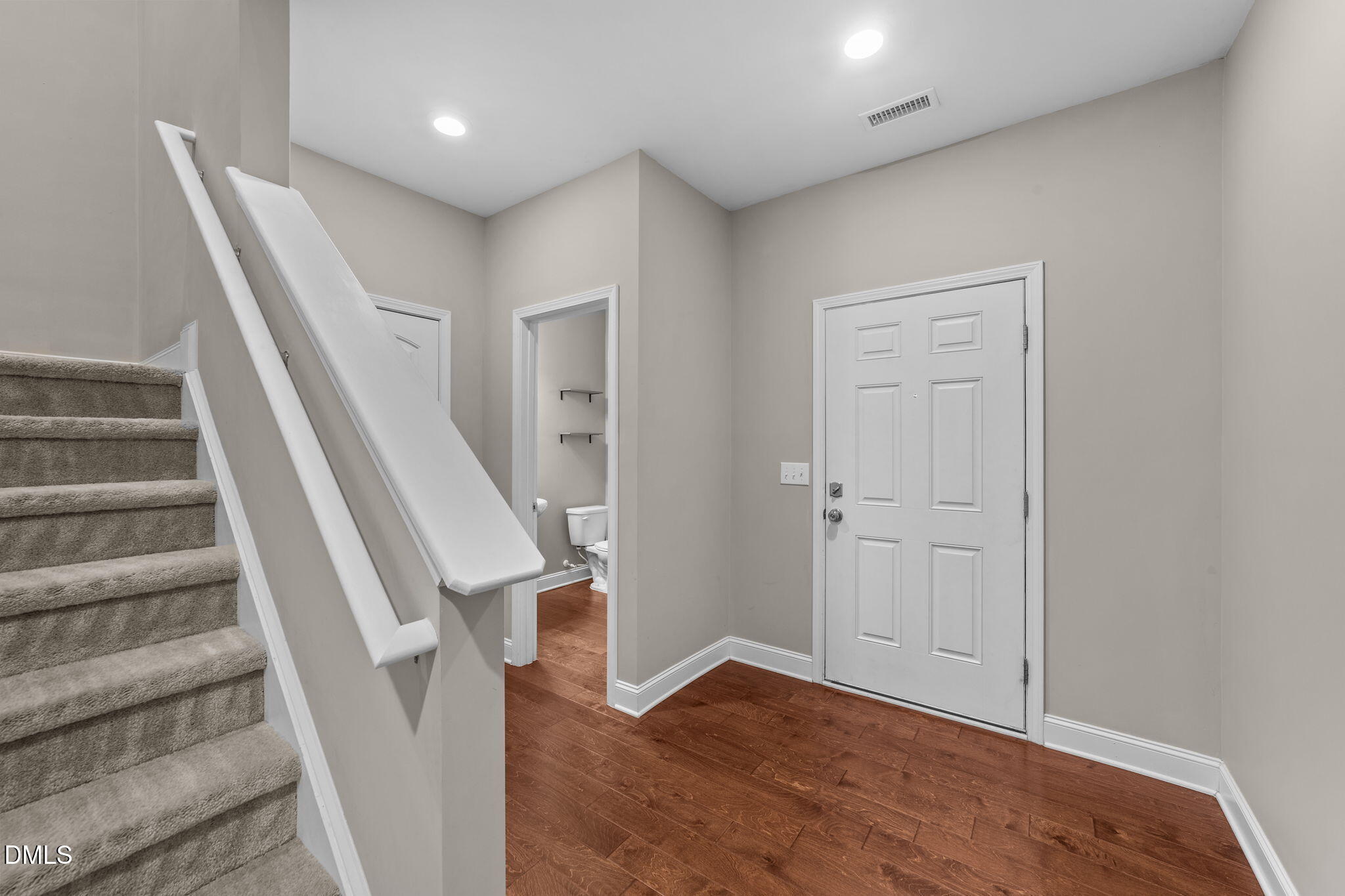26 Mint Julip Circle Clayton, NC 27527 - Photo 4 of 46 a view of entryway with wooden floor and stairs