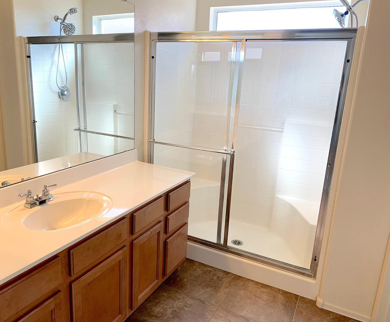 4132 East Chambers Street Phoenix, AZ 85040 - Photo 13 of 28 a bathroom with a shower and a sink