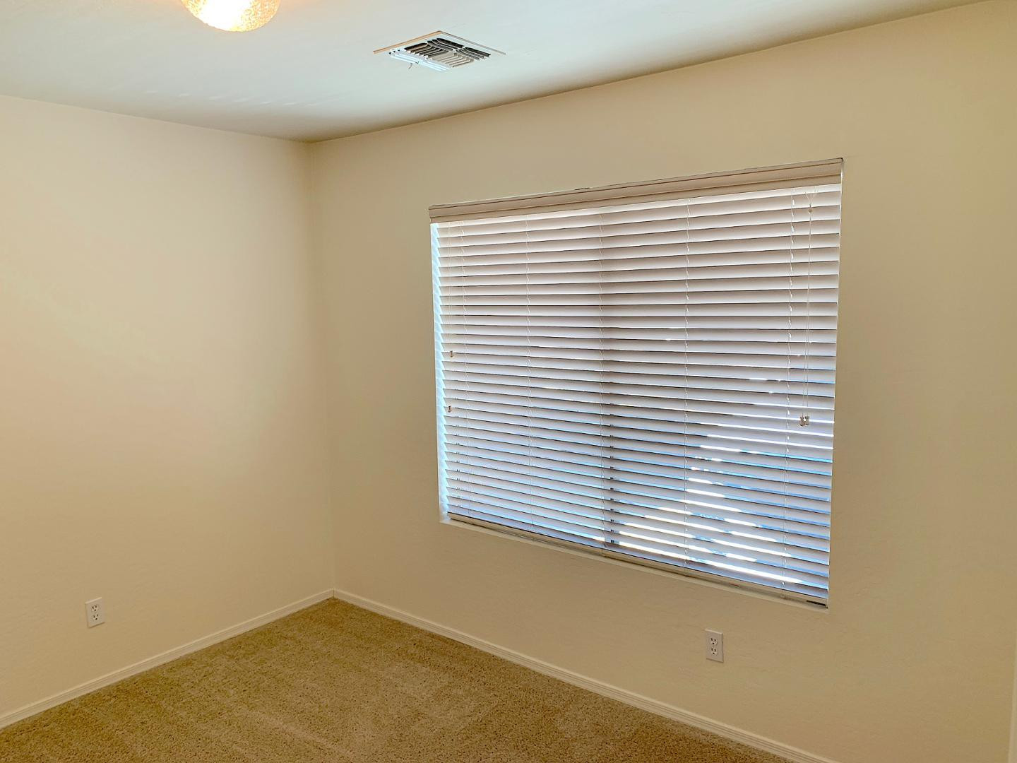 4132 East Chambers Street Phoenix, AZ 85040 - Photo 15 of 28 an empty room with a window